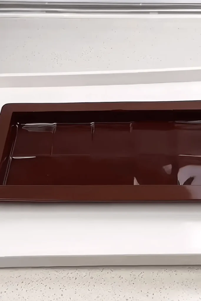 Chocolate coating set in mold for layering the bar