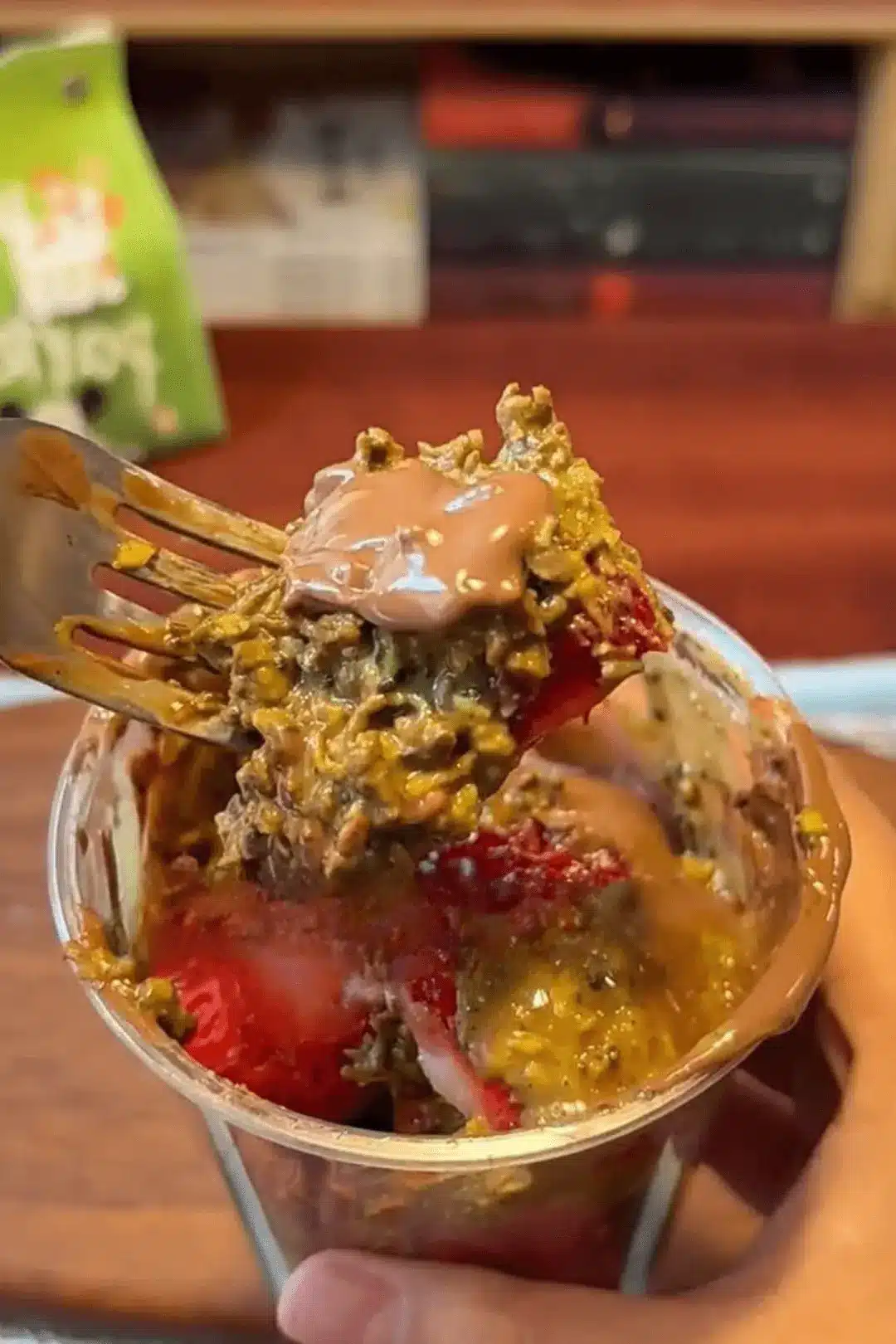 Close-up spoonful of Dubai strawberry cup layers