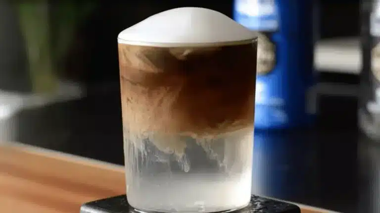 Coconut Cloud Coffee with creamy foam and swirling espresso layers
