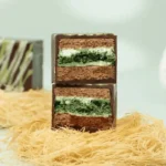 Dubai chocolate cake with pistachio kataifi crunch and whipped ganache layers