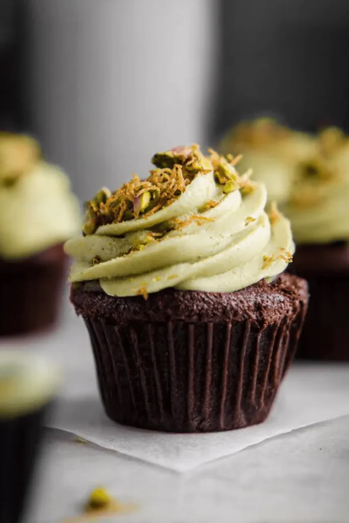 Dubai chocolate cupcake topped with pistachio cream and kataifi crunch