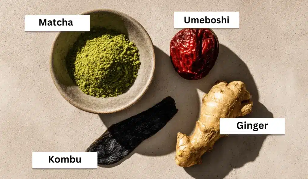 Labeled image showing matcha powder, umeboshi plum, kombu strip, and fresh ginger root