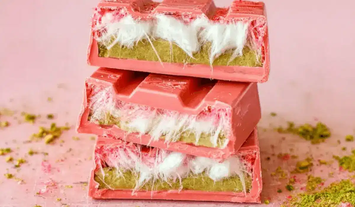 Stack of pink chocolate bars filled with pistachio cream and fluffy pişmaniye strands