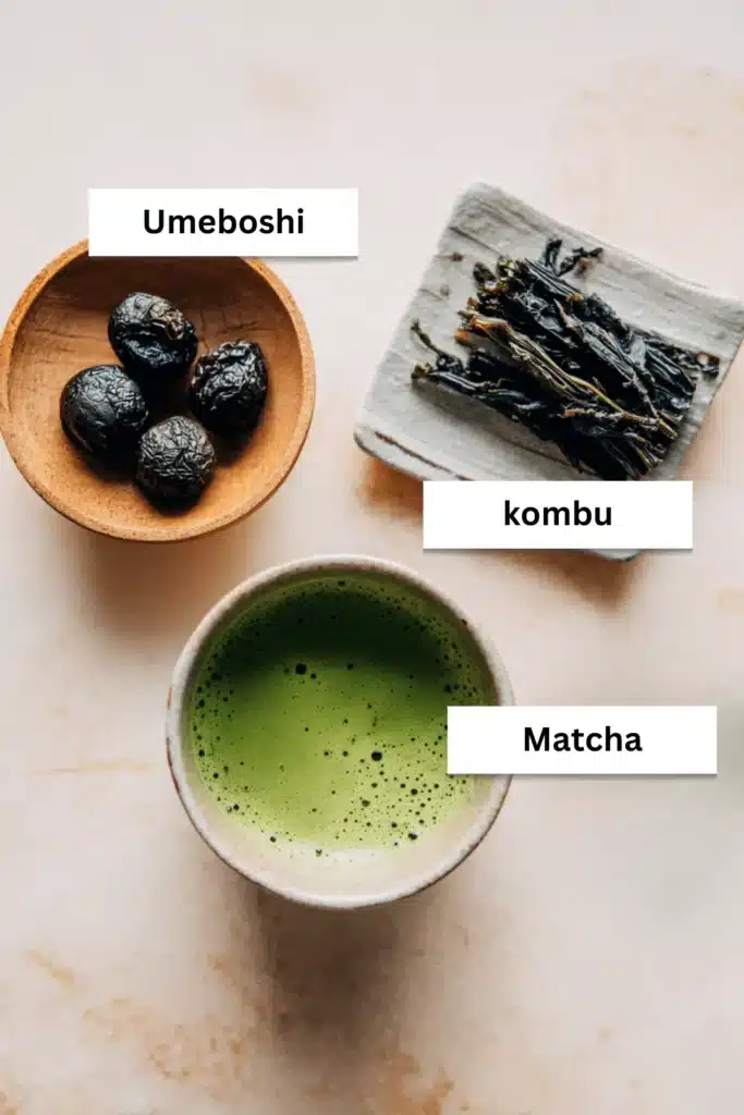 Flat lay of traditional Japanese Mounjaro ingredients including matcha, kombu seaweed, and umeboshi plum