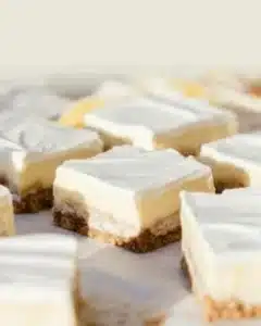 Delicious Banana Cream Pie Bars served on a white plate with banana slices