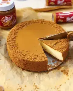 Delicious Biscoff Cheesecake topped with caramel drizzle and Biscoff cookies