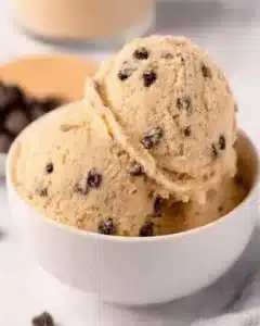 Delicious edible chocolate chip cookie dough in a bowl ready to serve.