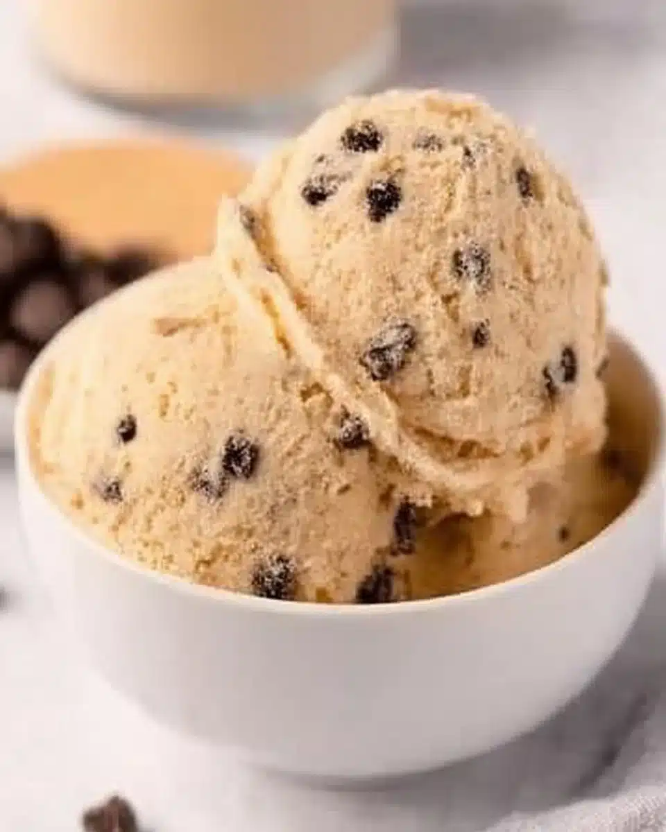 Delicious edible chocolate chip cookie dough in a bowl ready to serve.