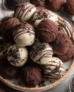 Delicious homemade Oreo Balls coated in chocolate, perfect for dessert.