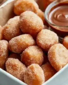 Delicious sweet air fryer churro bites served with chocolate dipping sauce